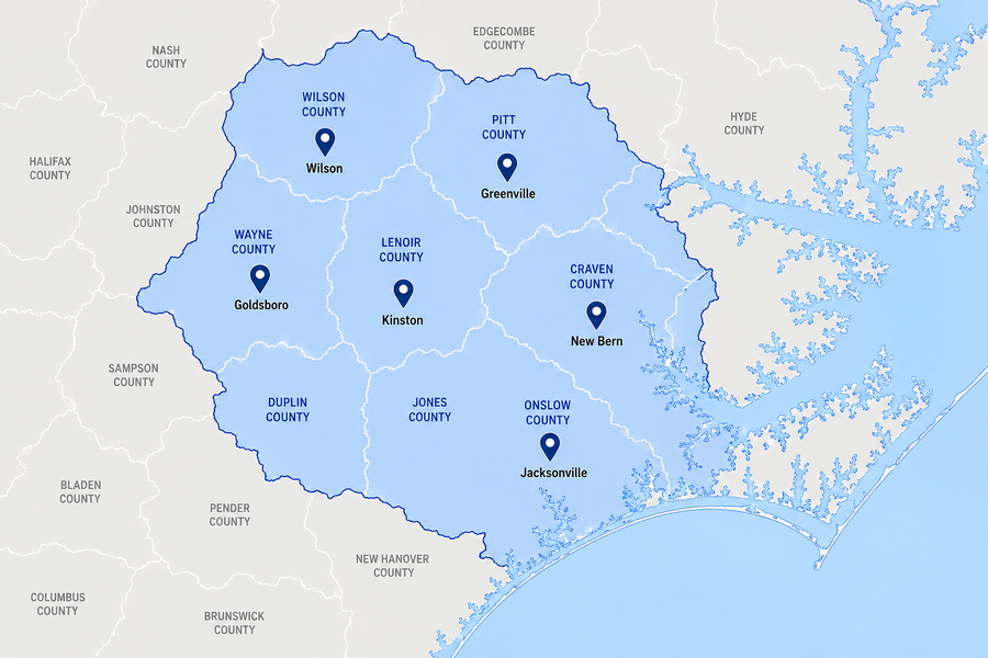 Highlighted blue region shows eastern North Carolina counties with city pins at Wilson, Greenville, Goldsboro, Kinston, New Bern, and Jacksonville.