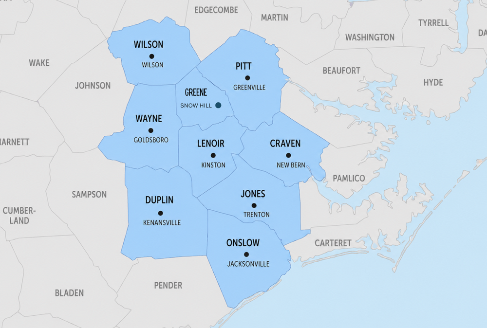 Your paragraph text 1 - Premier Restoration Services Kinston NC Regional map of eastern North Carolina with nine counties shaded blue: Wilson, Wayne, Duplin, Lenoir, Greene, Pitt, Craven, Jones, and Onslow; each county labeled with its name and county seat (dots show seats). Water to the east is shown by the coastline.